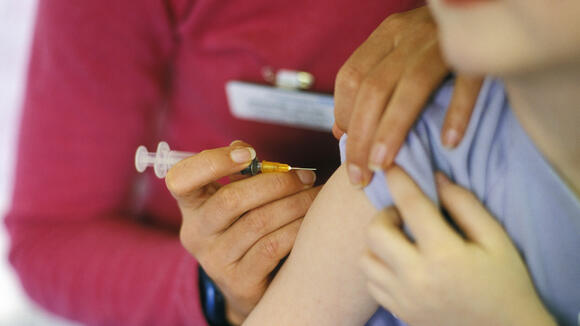 Child being given an MMR vaccine