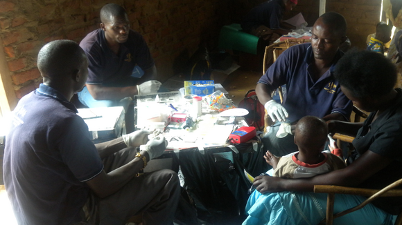 Blood samples being taken from a mother and child from Bukoba Village, Uganda
