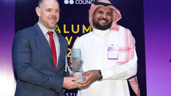 Dr Waleed receiving the award from deputy ambassador Mr Richard Oppenheim