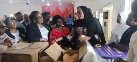 LSTM country director showing the training equipment at the launch of the CoE Gwagwalada